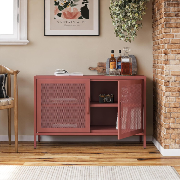 novogratz burgundy metal mesh cabinet with two doors, one of which is open showing cameras and books inside and there are drinks on top of the cabinet with a chair and piece of artwork next to it