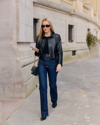 Woman wearing straight leg jeans.