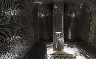 The Lanesborough Club and Spa London treatment rooms with black tiled steam baths