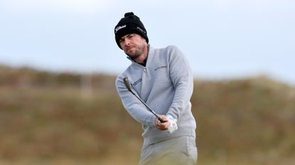 Laurie Canter of England plays a shot on the eighth hole during a Pro-Am prior to the Amgen Irish Open 2024 at Royal County Down Golf Club on September 11, 2024 in Newcastle, Northern Ireland.