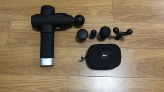 A photo of the Hyperice Hypervolt 2 Pro and the attachments