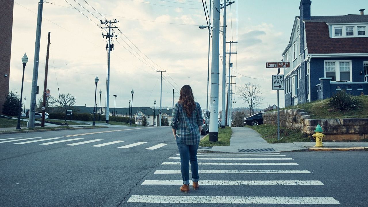 Road, Window, Road surface, Pedestrian crossing, Infrastructure, Street, Asphalt, Outerwear, Overhead power line, Urban area, 