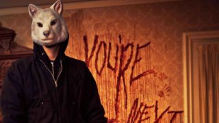 One of the masked killers in "You're Next" movie