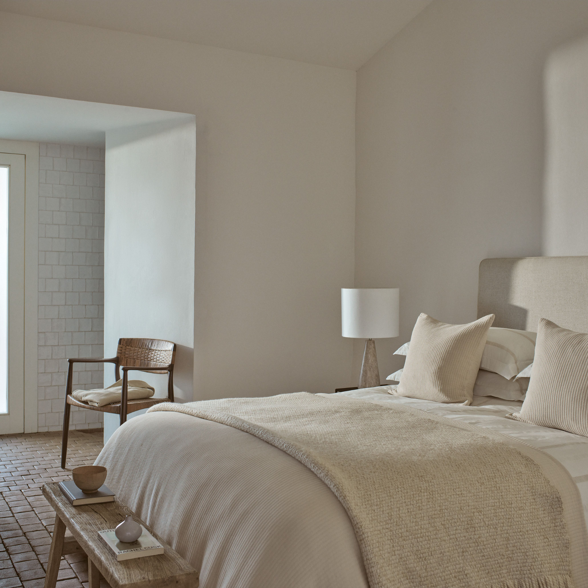The White company bedding and Marlow table lamp in a modern, neutral bedroom.