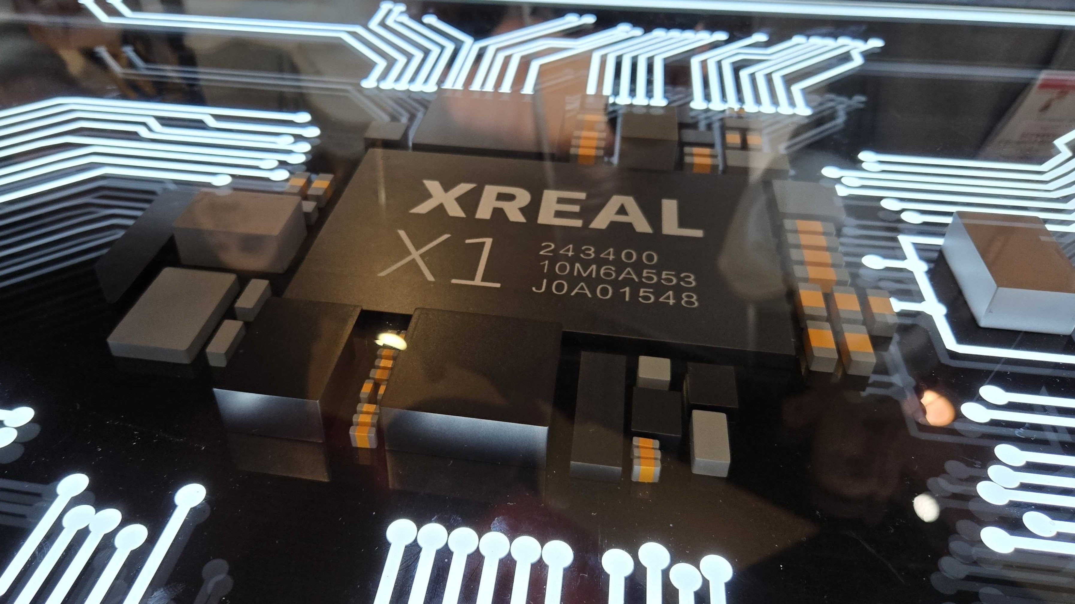 A large dummy Xreal X1 chipset in a table