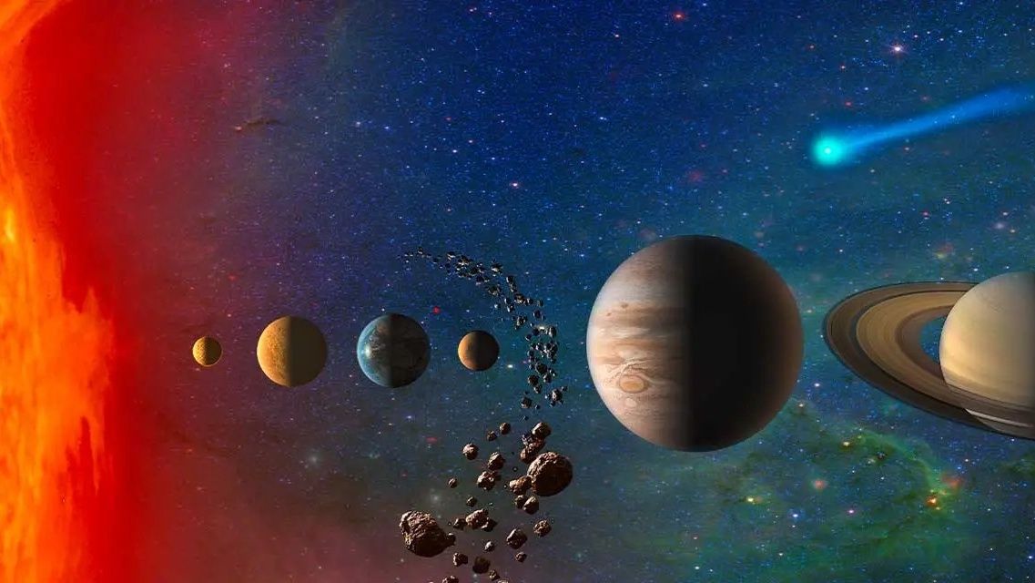 an array of planetary bodies and an asteroid belt stretch from left to right across space.