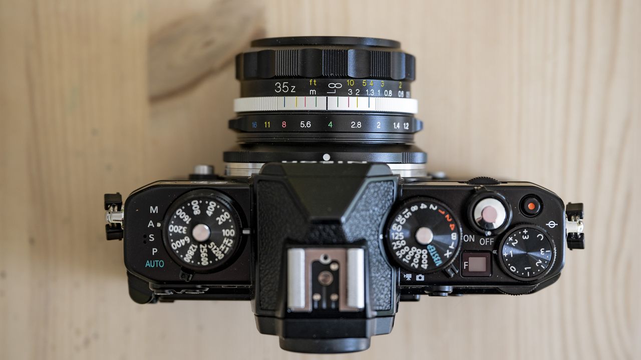 Voigtlander D 35mm f1.2 Nokton lens on a wooden table