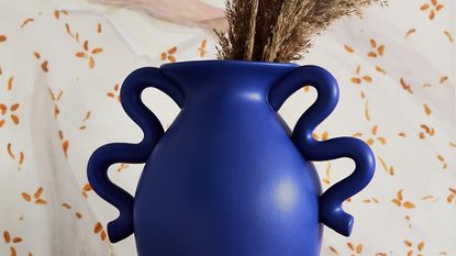 Cobalt blue vase with squiggly arms