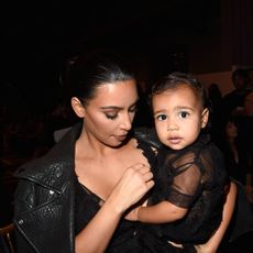 paris, france september 28 l r kim kardashian and baby north west attend the givenchy show as part of the paris fashion week womenswear springsummer 2015 on september 28, 2014 in paris, france photo by pascal le segretaingetty images