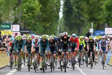 After the mass crash and neutralisation on stage 5 at Critérium du Dauphiné, the peloton reaches the line