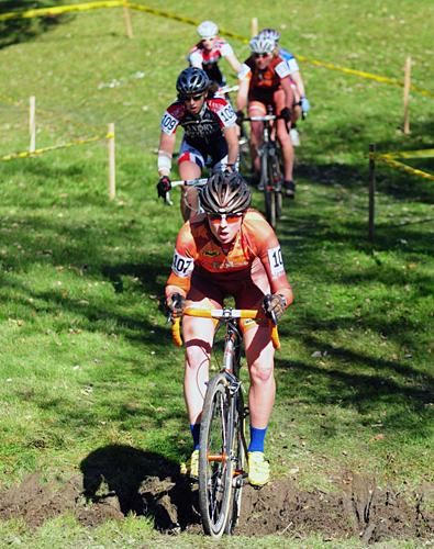 Linnea Koons (October Factory Racing) leads a group through a small mud bog.