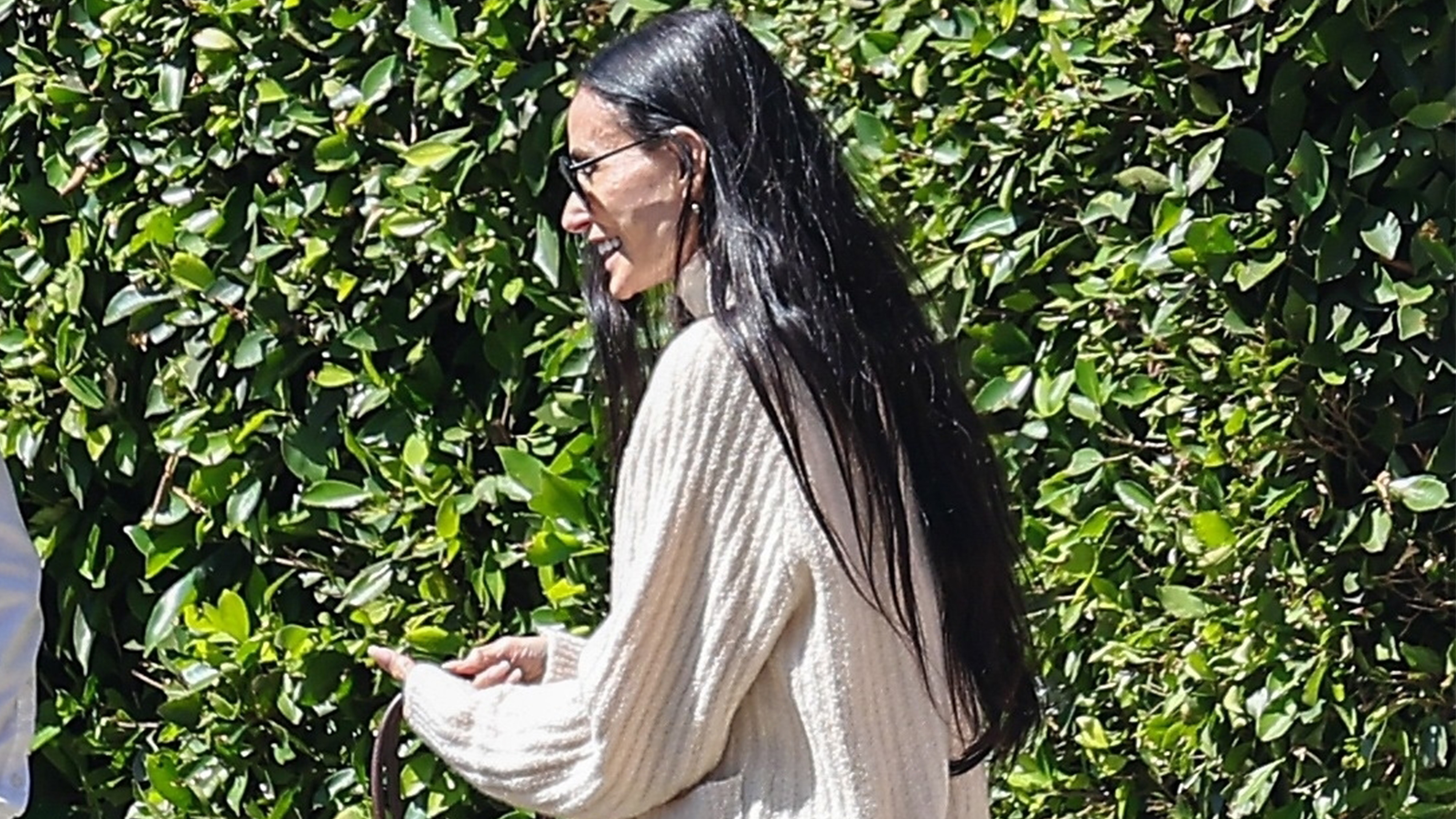 Demi Moore wears an ivory sweater.