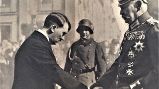Adolf Hitler shaking hands with President Hindenburg