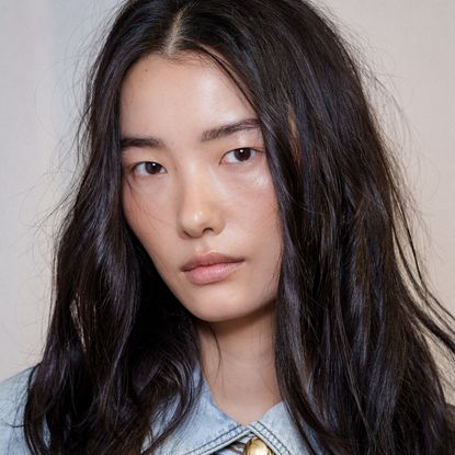 A model with hydrated under-eyes thanks to a hydrating eye cream.