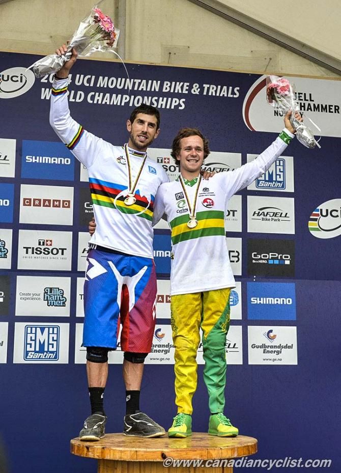 Elite men's downhill world championship podium: Gee Atherton (Great Britain) and Troy Brosnan (Australia). Josh Bryceland (Great Britain), 2nd, went to the hospital instead of the podium