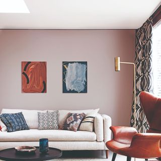 A living room with pink-painted walls