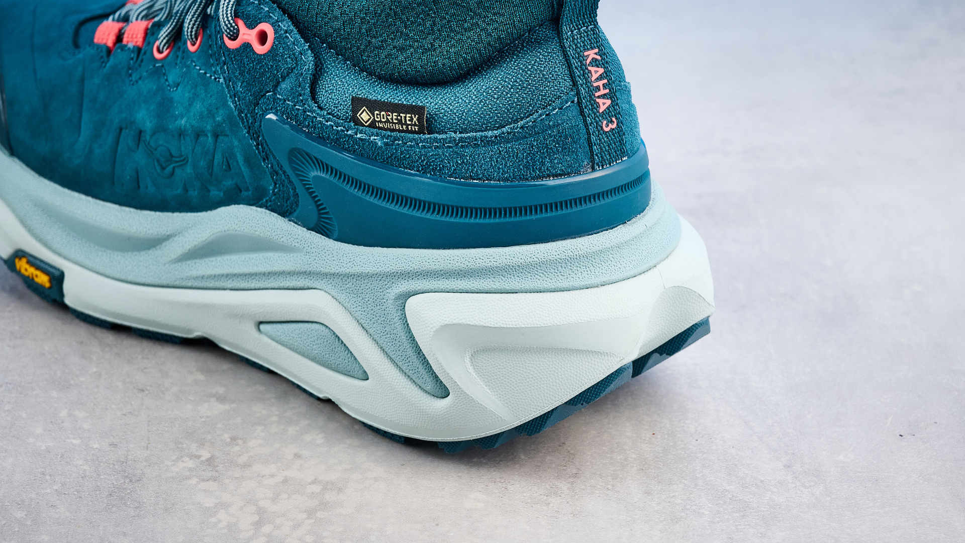 Hoka Kaha 3 Low GTX in droplet colorway photographed in front of a blue background