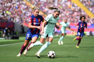 Johanna Rytting Kaneryd of Chelsea is challenged by Alexia Putellas of FC Barcelona during the UEFA Women's Champions League 2023/24 semi-final Leg One match between FC Barcelona and Chelsea FC at Estadi Olímpic Lluís Companys on April 20, 2024 in Barcelona, Spain. 
