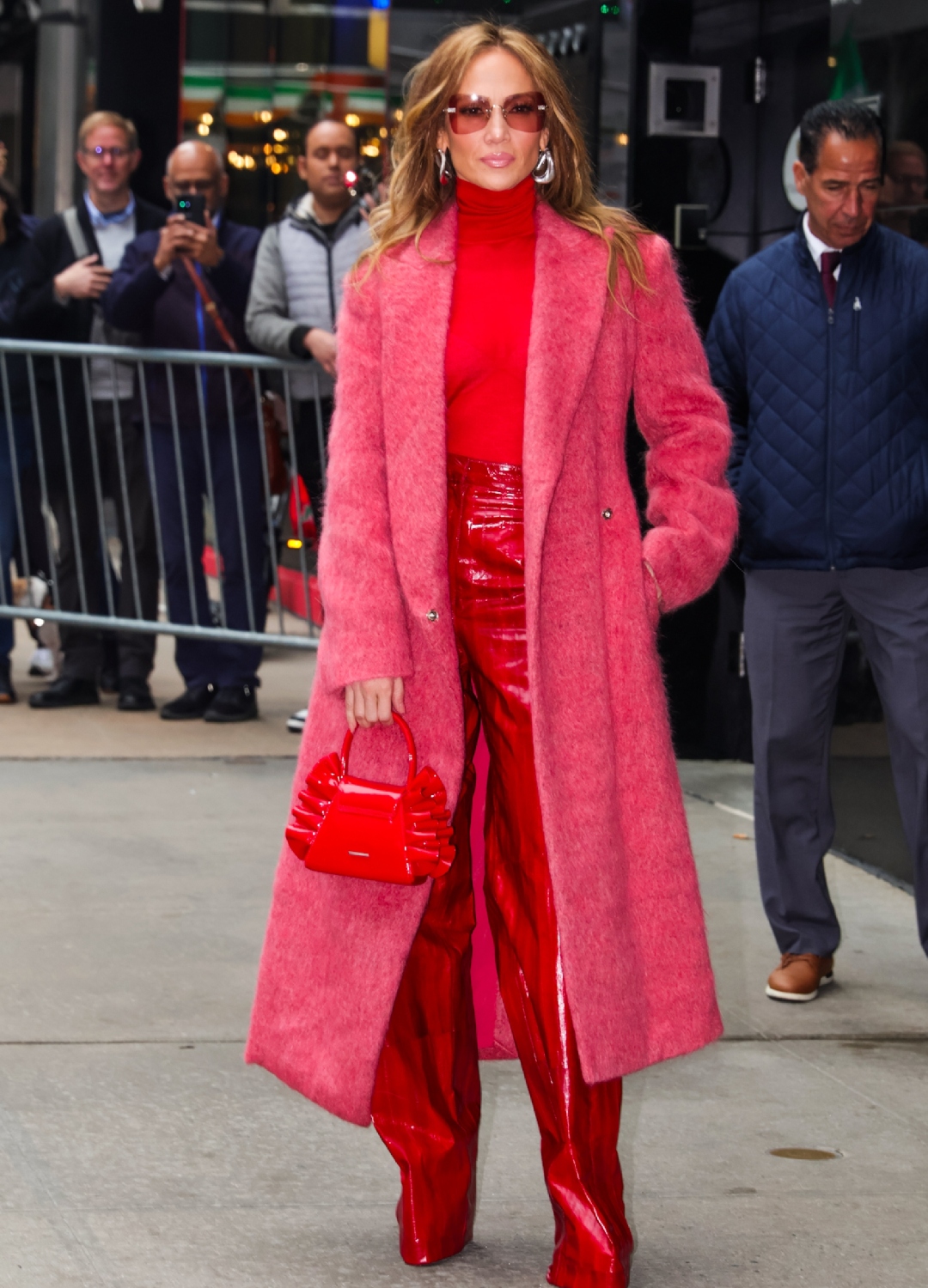 Jennifer Lopez wearing pink coat