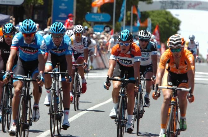 Race leader Geraint Thomas (Sky) crosses the line with Garmin Sharp teammates Steele Von Hoff and Jack Bauer on Stage 4
