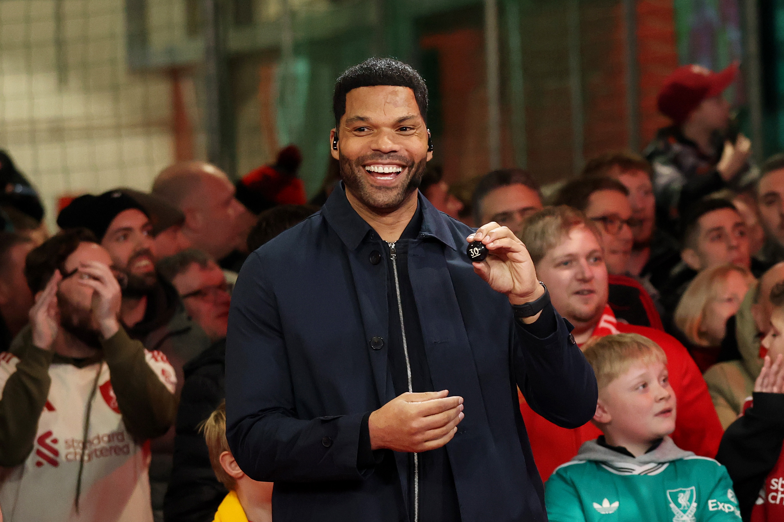LIVERPOOL, ENGLAND - JANUARY 12: Joleon Lescott, English former football player and coach, reacts after drawing the number &amp;amp;apos;30 - Macclesfield&amp;amp;apos; during the Emirates FA Cup Fourth Round draw prior to the Emirates FA Cup Third Round match between Liverpool and Barnsley on January 12, 2026 in Liverpool, England. (Photo by Carl Recine/Getty Images)