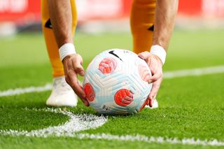 Joao Moutinho of Wolverhampton Wanderers places the ball for a corner kick during the Premier League match between Liverpool and Wolverhampton Wanderers at Anfield on May 22, 2022 in Liverpool, England.