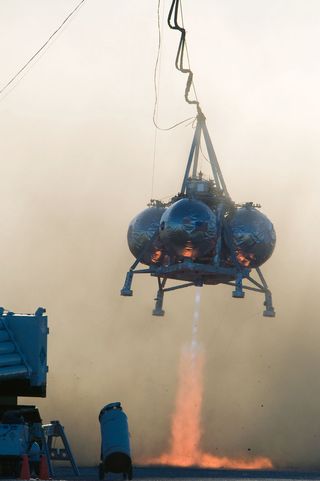 NASA's Morpheus Lander flies during its third tethered test at Johnson Space Center.