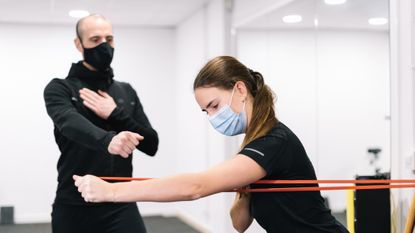 Man and woman training with face masks