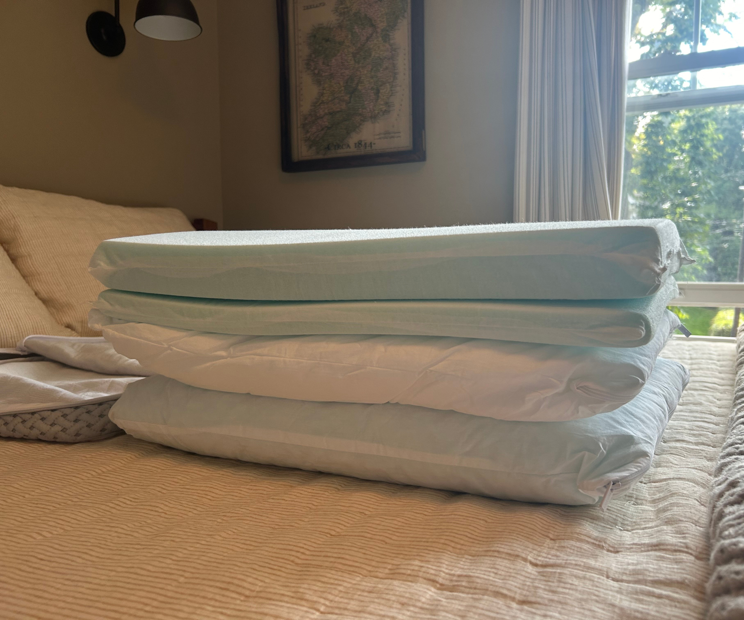 a stack of several pillow inserts