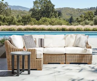 Huntington Wicker 4-Piece Slope Arm Outdoor Sectional from Pottery Barn on a pool patio