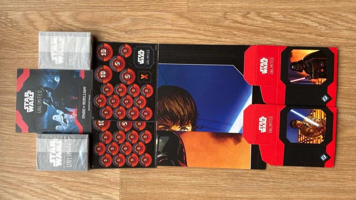 Star Wars Unlimited contents on a table, it includes two decks, counters and paper playmats