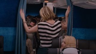 Kristen Wiig pulling the curtains open on the plane in Bridesmaids.