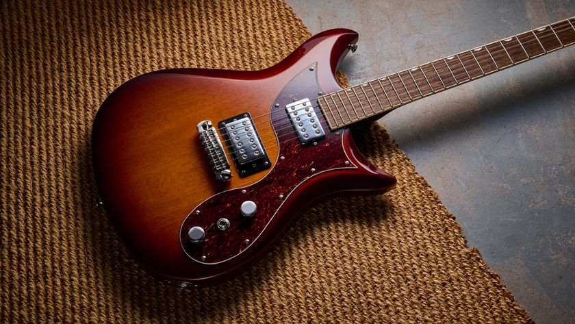 A Gretsch Electromatic CVT electric guitar lying on a rug