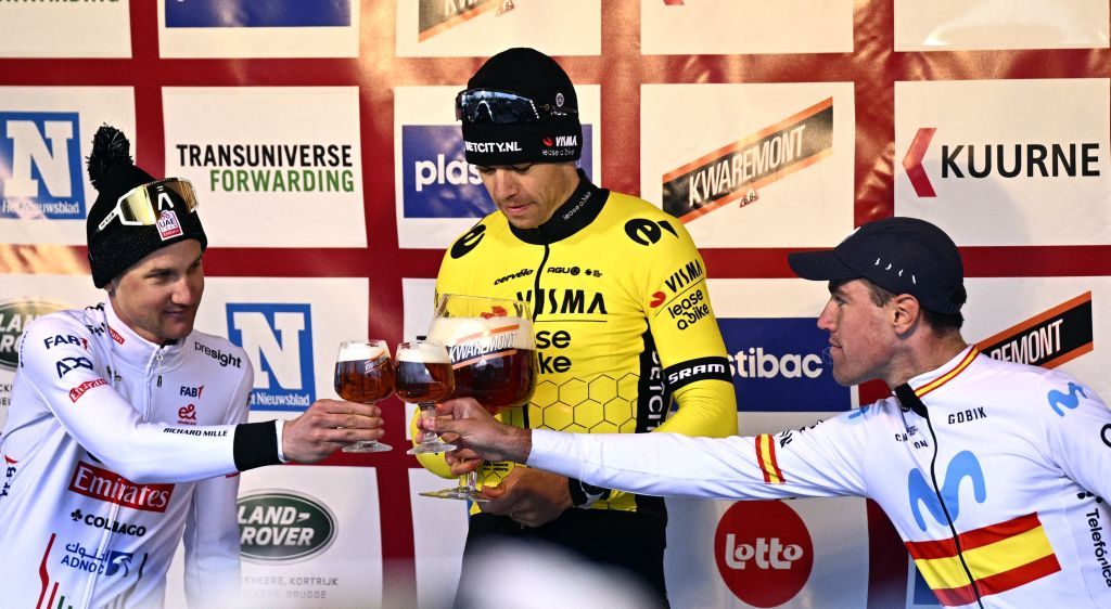 Belgian Tim Wellens of UAE Team Emirates, Belgian Wout van Aert of Team Visma-Lease a Bike and Spanish Oier Lazkano of Movistar Team celebrate on the podium after winning the Kuurne-Brussels-Kuurne one day cycling race, 196,4 km from Kuurne to Kuurne via Brussels, Sunday 25 February 2024. BELGA PHOTO JASPER JACOBS (Photo by JASPER JACOBS / BELGA MAG / Belga via AFP)