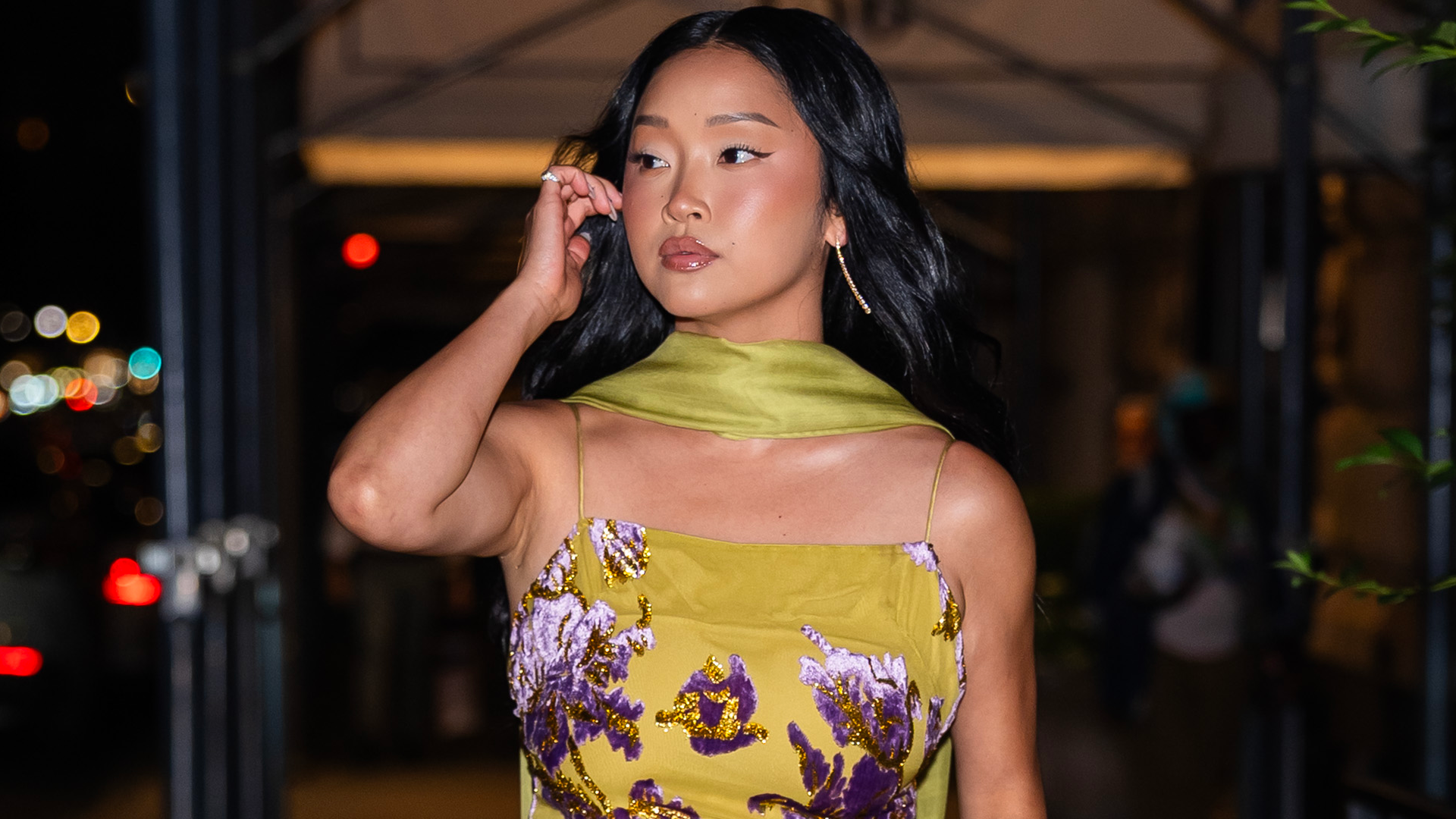 Lana Condor was spotted in NYC wearing the perfect wedding guest dress in moss green and lilac purple
