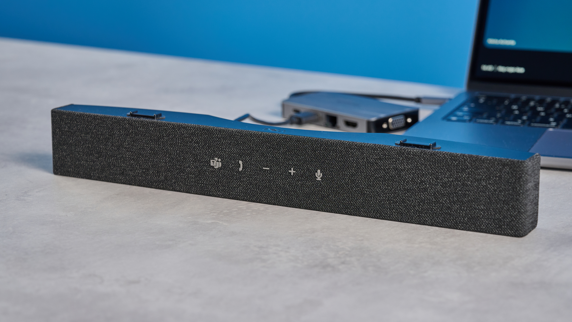 Dell SB725 computing conference soundbar photographed on a blue background