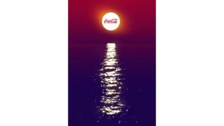 Coca-Cola optical illusion ad with what looks like a bottle reflected in water