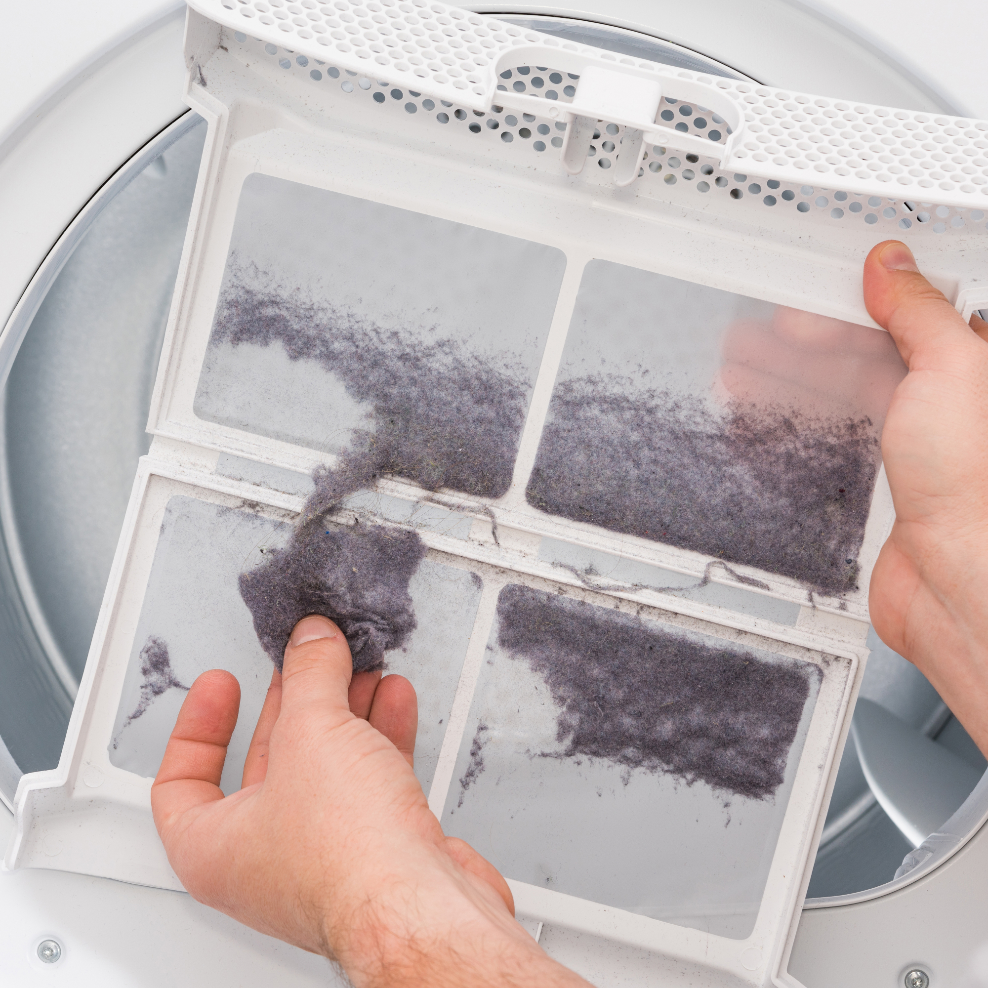 Man removing dryer lint from trap