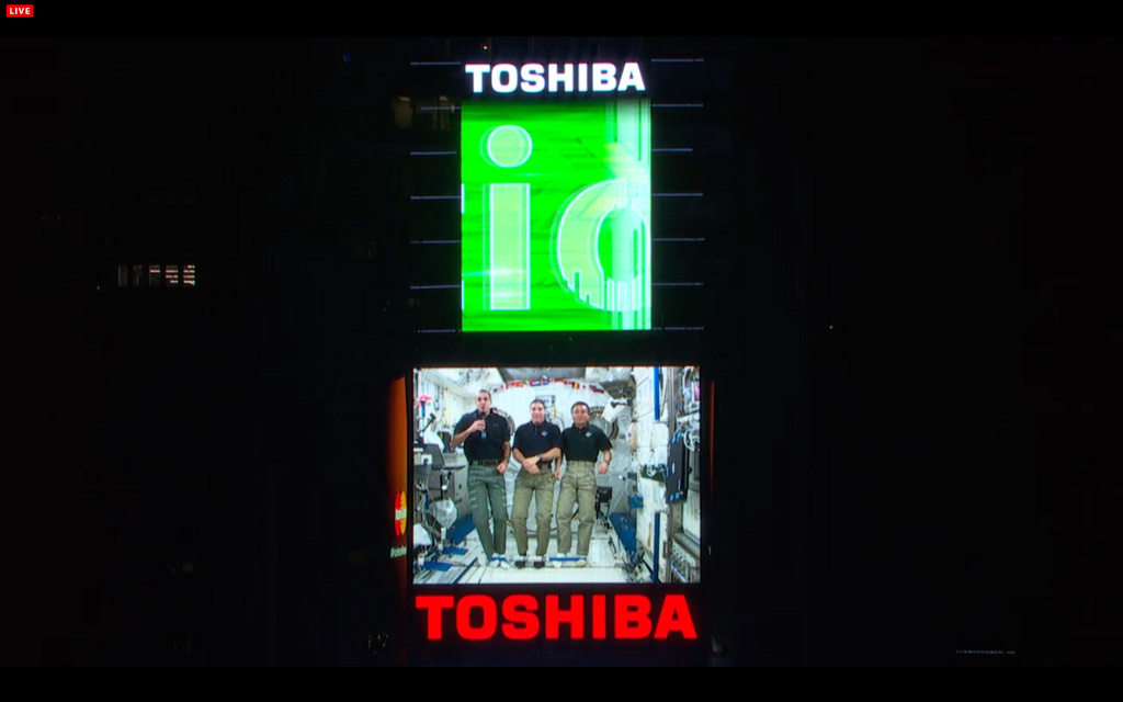 Astronauts on the International Space Station wish Earth a Happy New Year for 2014 in a video message shown in New York City&#039;s Times Square during the New Year&#039;s Eve bash on Dec. 31, 2013. From left, they are: Rick Mastracchio and Mike Hopkins, both of N