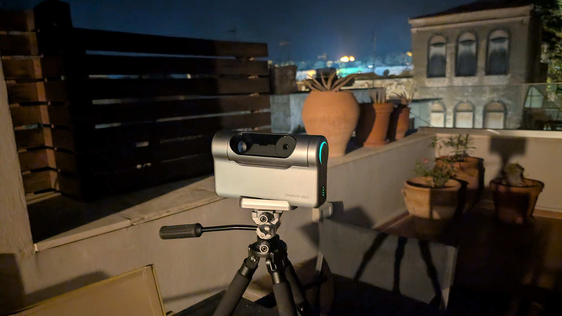 The Dwarf III smart telescope photographed on a rooftop terrace at night