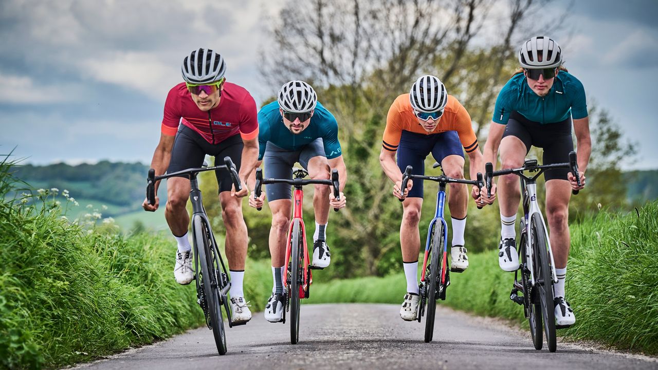 Image of four cyclists riding towards the camera