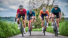 Image of four cyclists riding towards the camera