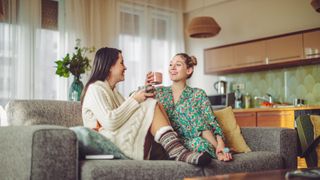 Two friends sat on a couch