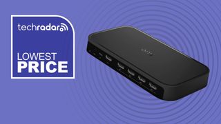 Philips Hue Play HDMI Sync Box 8K on purple background with white text reading 'TechRadar lowest price'