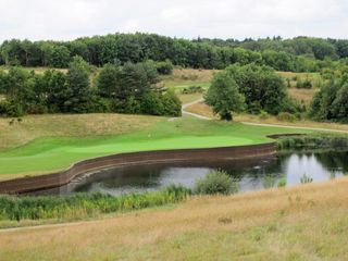 The dramatic par 3 at twelve is played from an elevated tee
