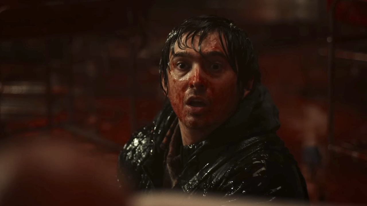 Brian covered in blood and looking scared in Resident Evil (2026)
