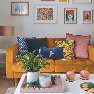 Mustard sofa with mismatched cushions