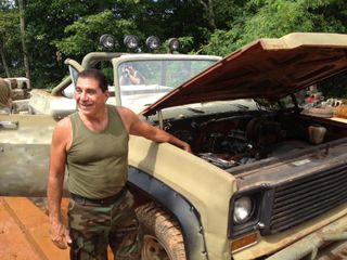 Brent stands next to his 1974 Chevy blazer that runs on propane. To run after an EMP event, cars have to be pre-1975, Brent said. That's because in 1975 cars began being outfitted with microchips, which can be disabled by an EMP or enormous solar flare. H