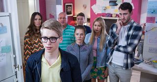 Alfie Nightingale is surrounded by papers and calculations at The Cunningham’s in Hollyoaks.