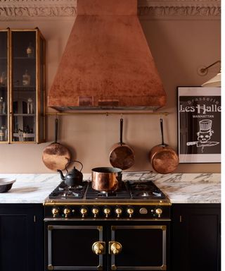 black and pink kitchen with copper hood and accessories by devol
